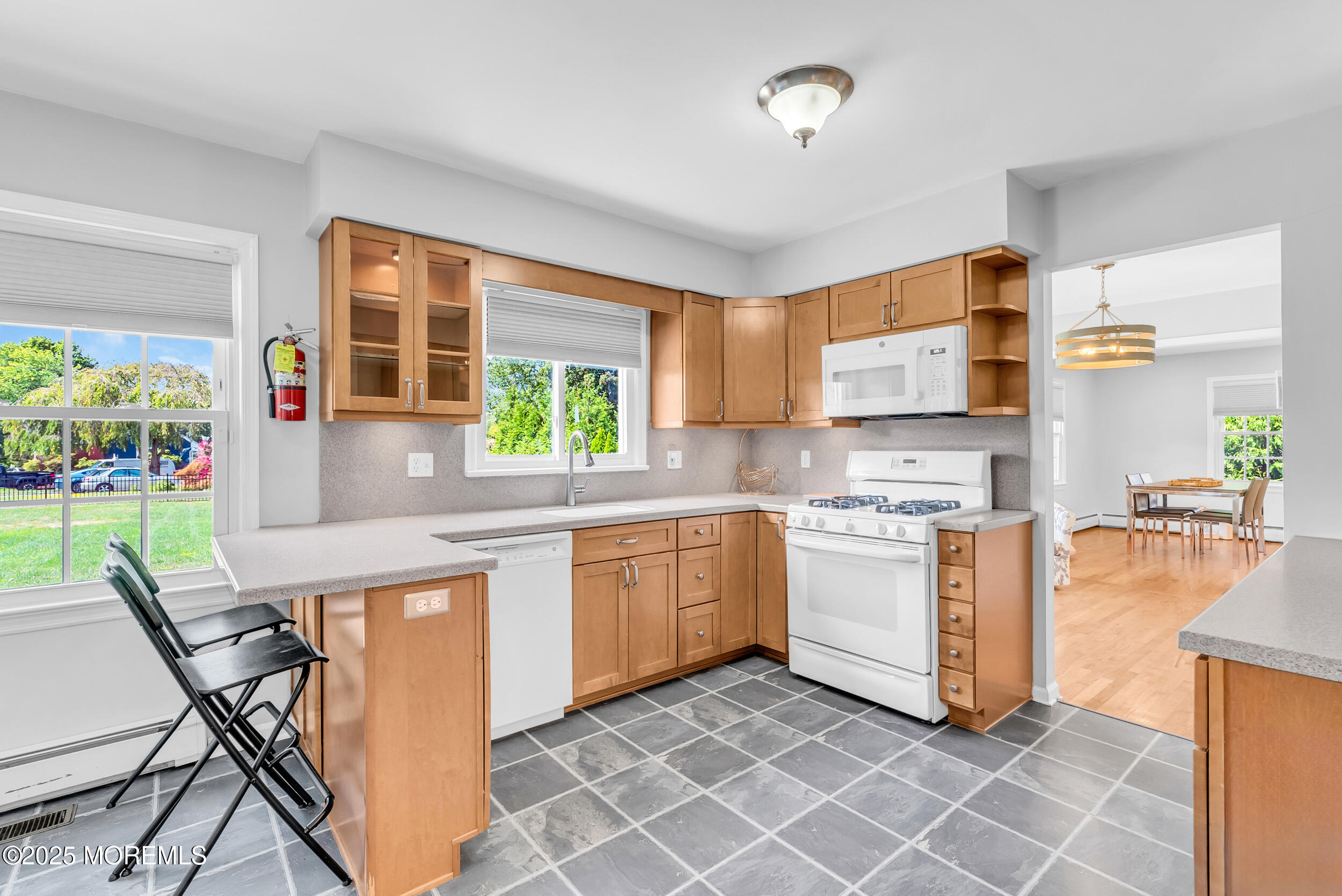 11 Pinewood Avenue West Long Branch, NJ 07764 - Photo 12 of 39 a kitchen with appliances cabinets and furniture