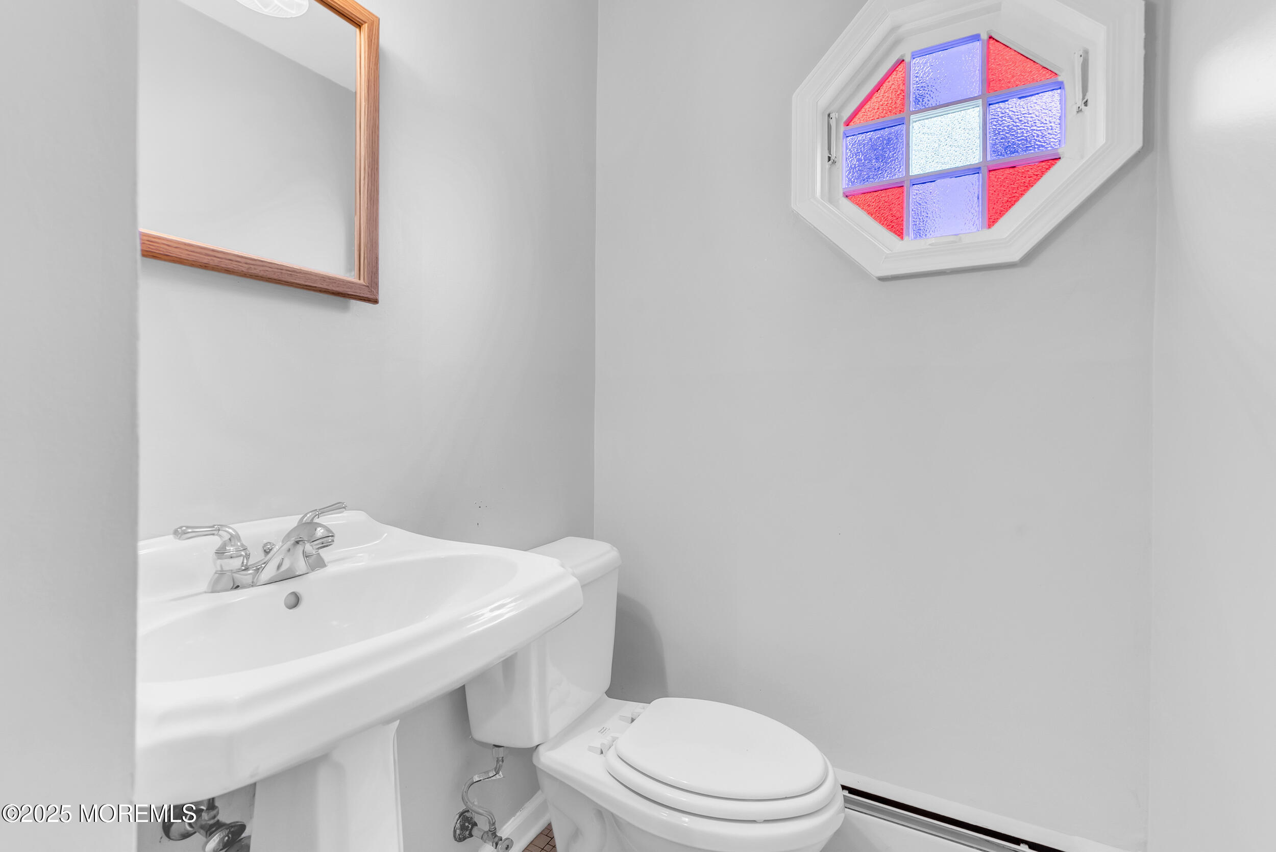 11 Pinewood Avenue West Long Branch, NJ 07764 - Photo 19 of 39 a bathroom with a sink and a mirror