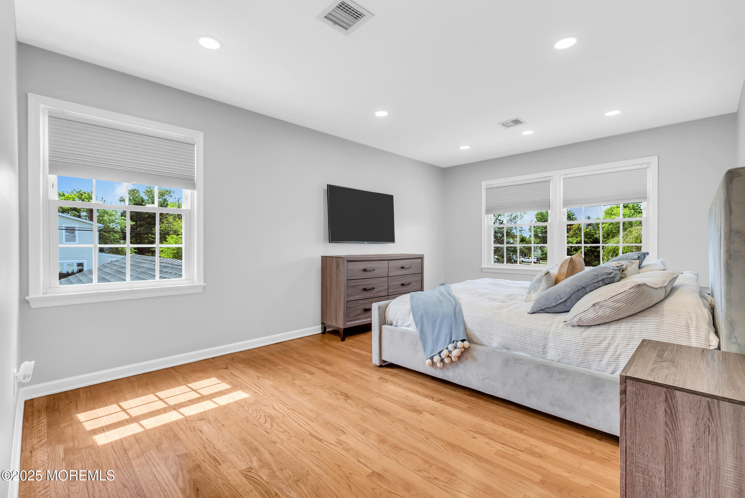 11 Pinewood Avenue West Long Branch, NJ 07764 - Photo 20 of 39 a living room with furniture and a flat screen tv