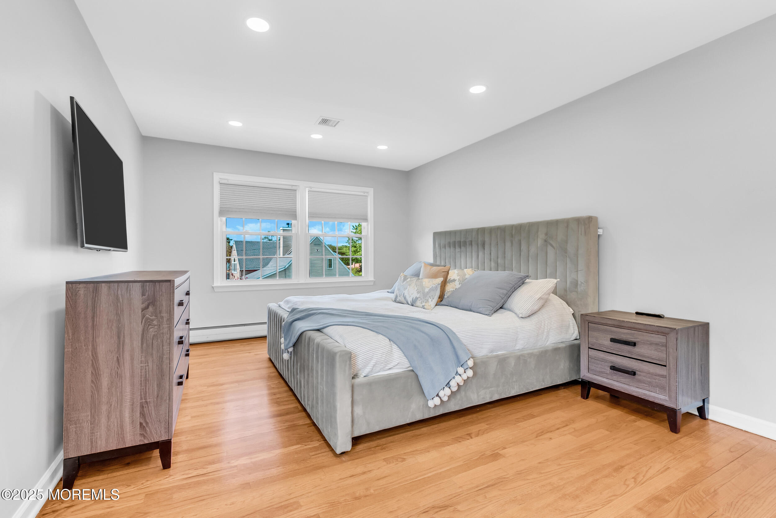 11 Pinewood Avenue West Long Branch, NJ 07764 - Photo 21 of 39 a spacious bedroom with a bed and a large window