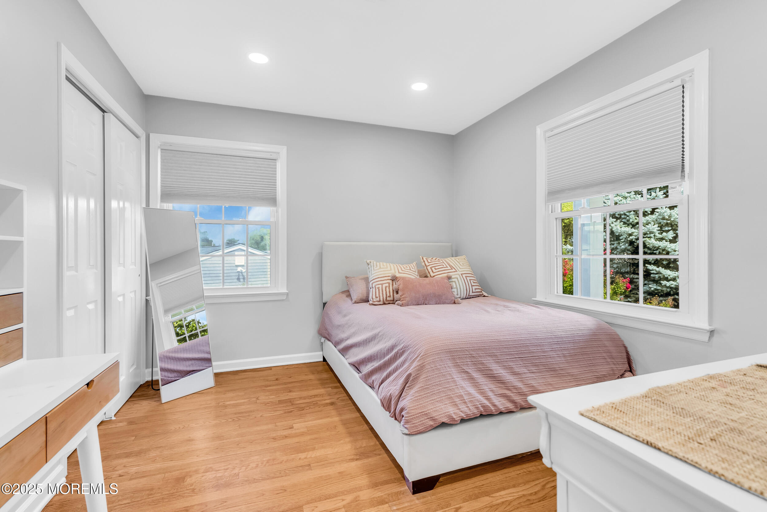 11 Pinewood Avenue West Long Branch, NJ 07764 - Photo 25 of 39 a bedroom with a bed and wooden floor