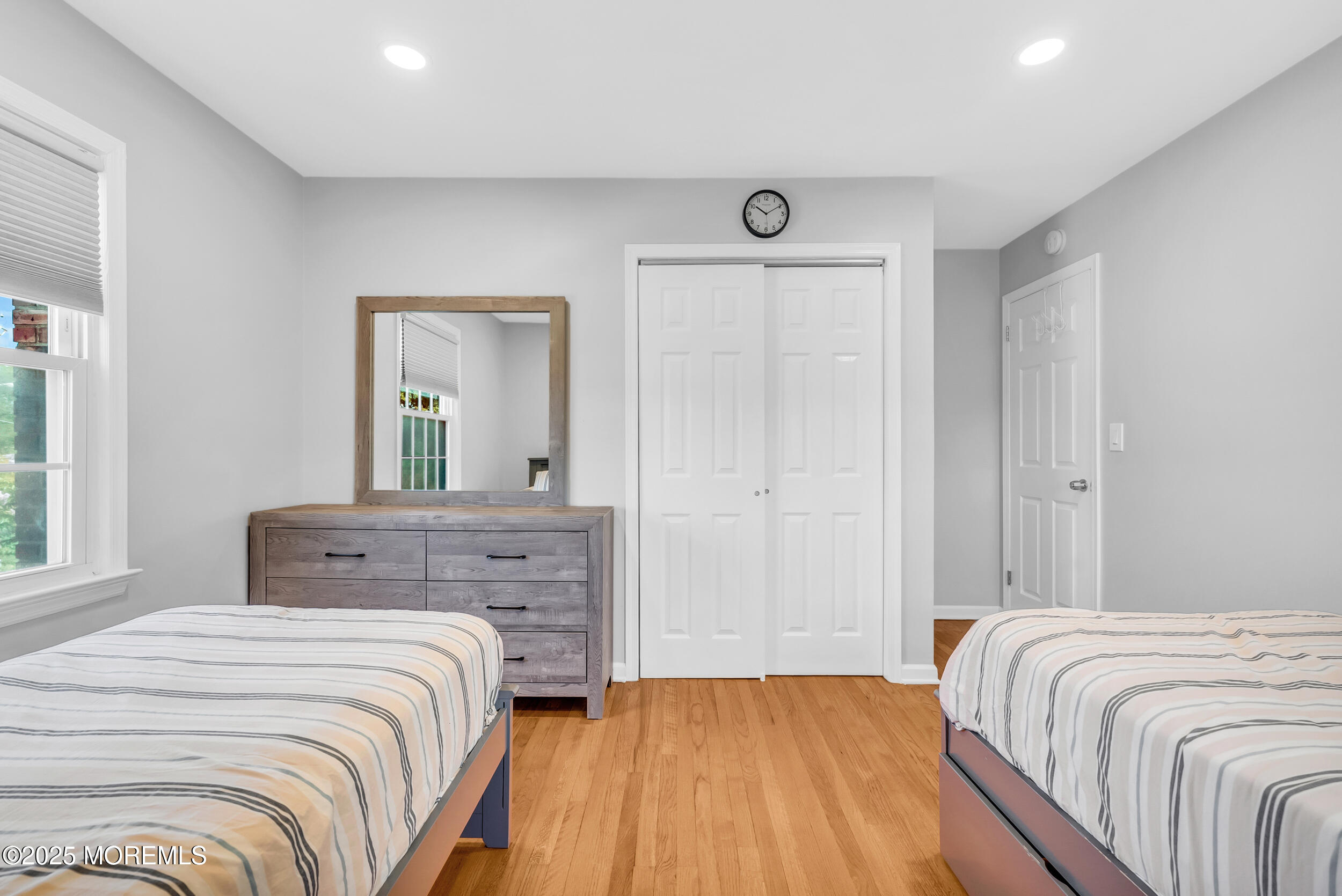 11 Pinewood Avenue West Long Branch, NJ 07764 - Photo 28 of 39 a bedroom with a bed and a mirror