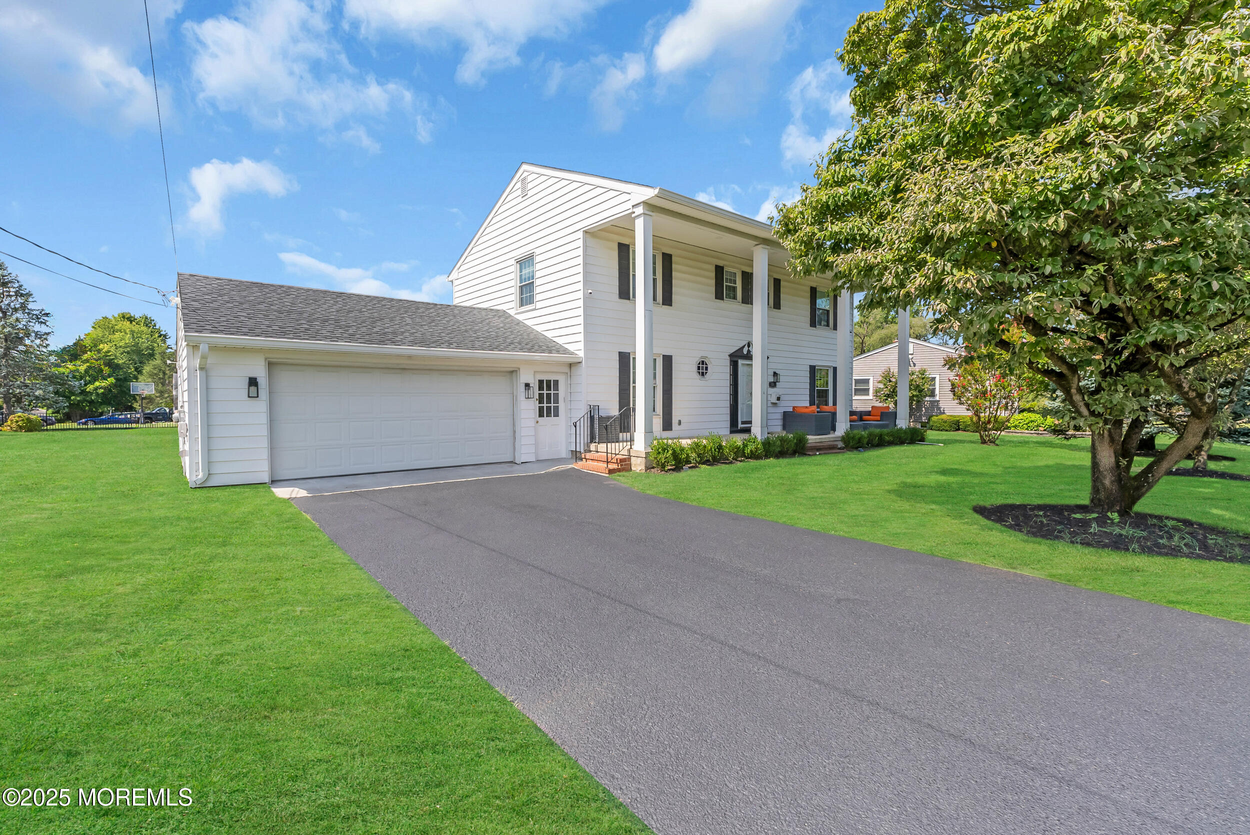 11 Pinewood Avenue West Long Branch, NJ 07764 - Photo 39 of 39 a view of a white house with a big yard and large tree