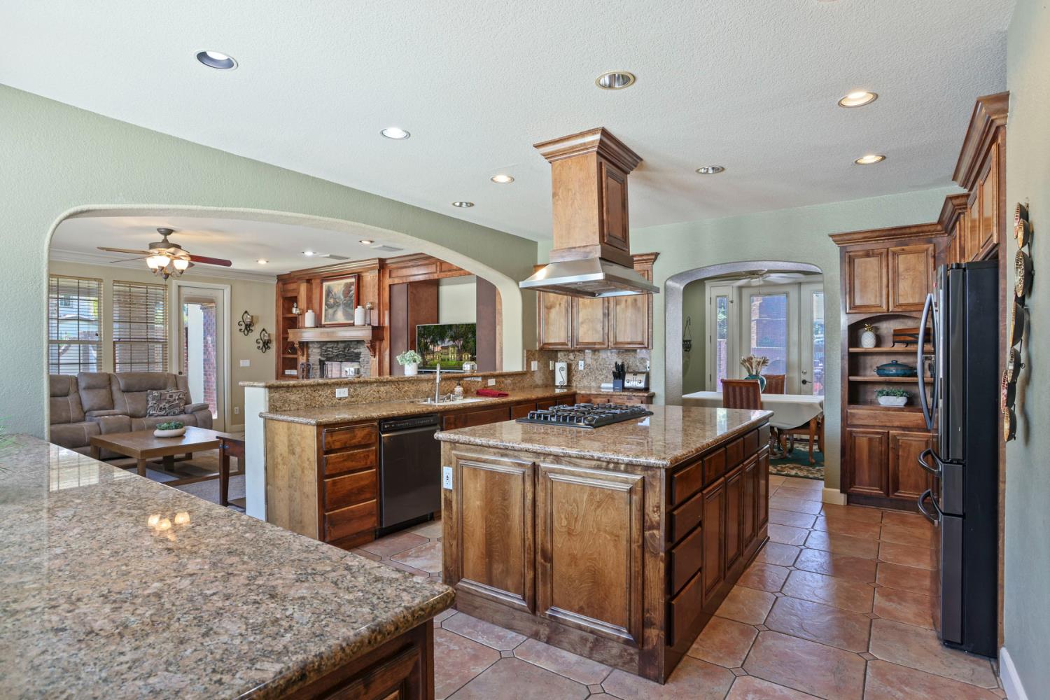 3044 Redbridge Road Tracy, CA 95377 - Photo 15 of 88 a kitchen with stainless steel appliances granite countertop a stove oven and a refrigerator