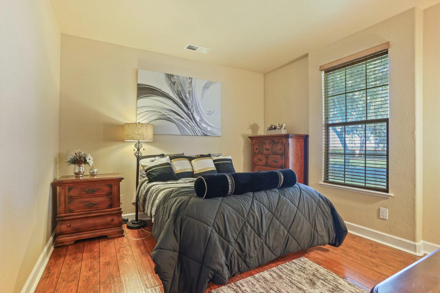 3044 Redbridge Road Tracy, CA 95377 - Photo 31 of 88 a bedroom with a bed and wooden floor