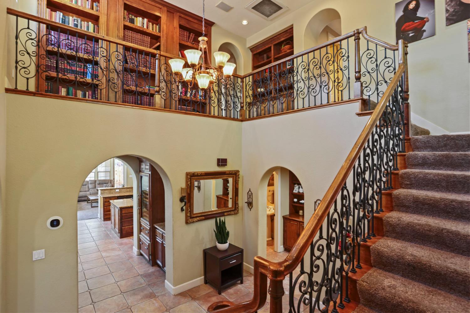 3044 Redbridge Road Tracy, CA 95377 - Photo 35 of 88 a view of staircase with lots of frames on wall and windows