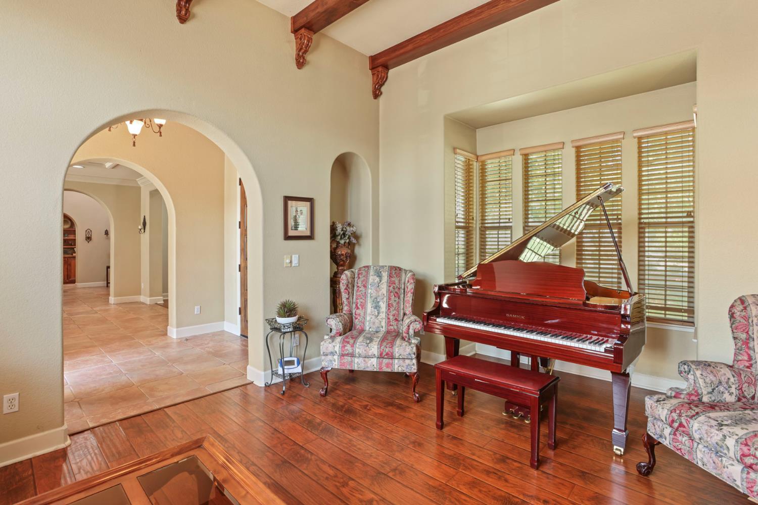 3044 Redbridge Road Tracy, CA 95377 - Photo 8 of 88 a living room with furniture a table and wooden floor