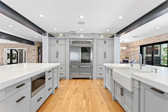 a room with a bed and a chandelier