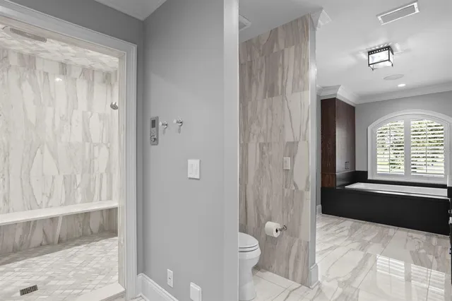 a outdoor space with a large window and furniture