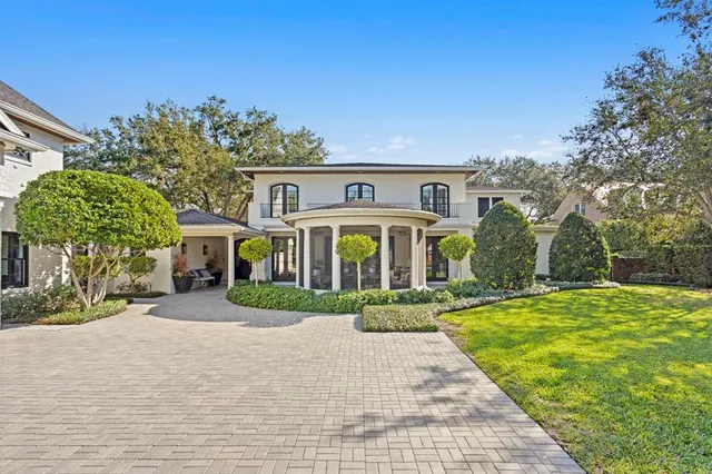 a dining room with furniture window and wooden floor