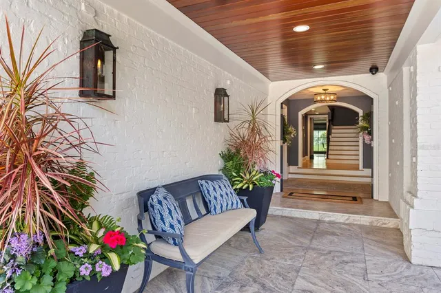 a large dining hall with stainless steel appliances granite countertop a stove and a chair