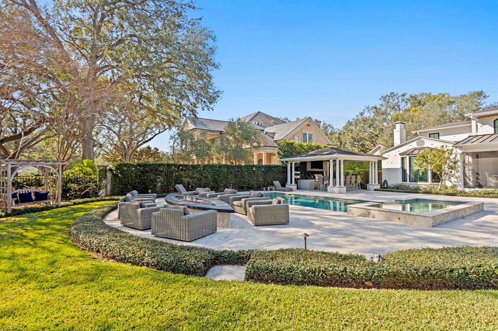 1002 South Frankland Road Tampa, FL 33629 - Photo 69 of 88 a front view of a house with garden and sitting area