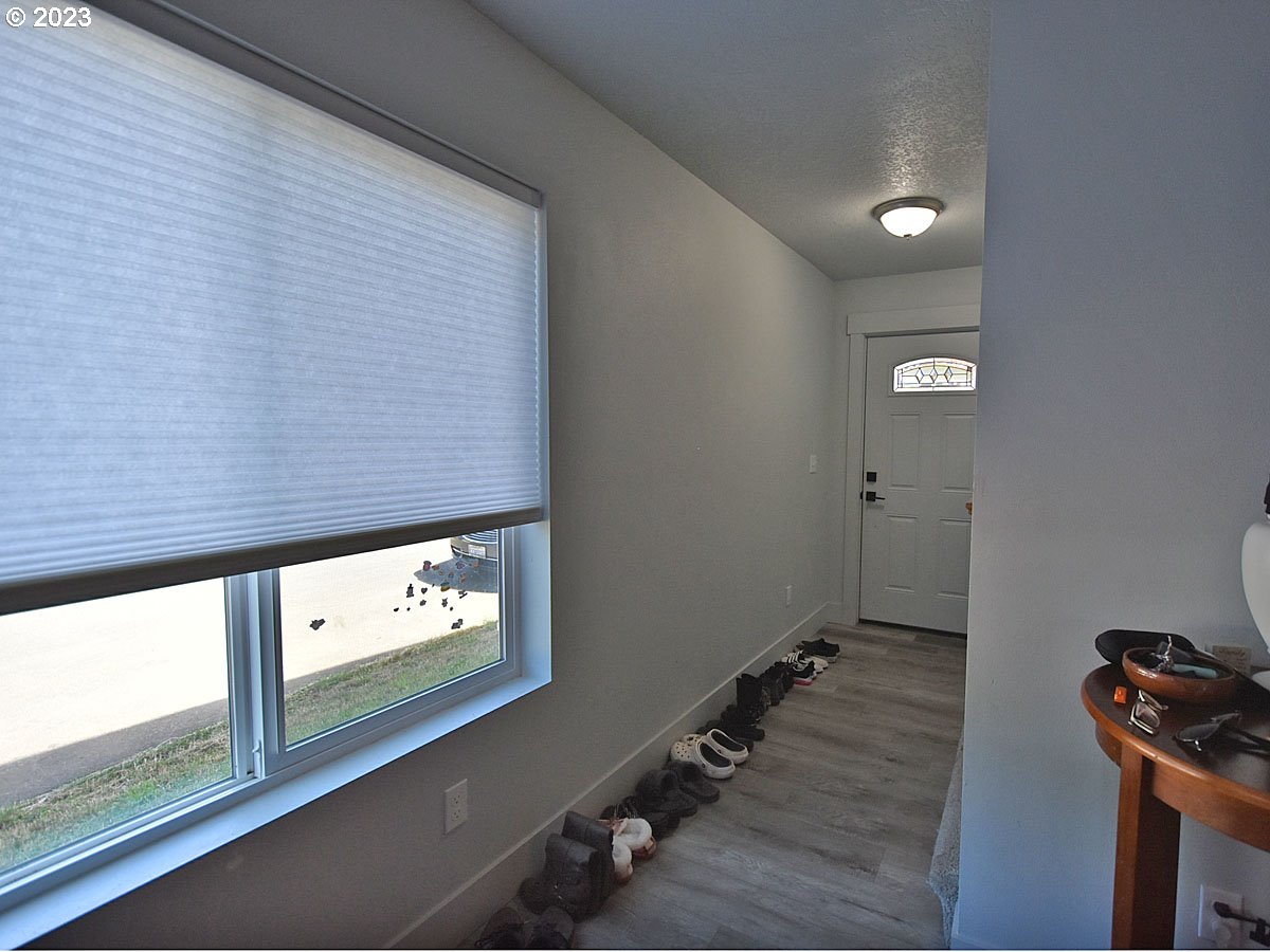 306 Oak Street Winlock, WA 98596 - Photo 15 of 35 a view of a hallway with paintings on the wall