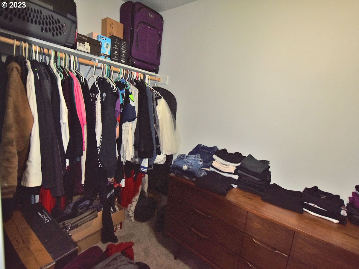 306 Oak Street Winlock, WA 98596 - Photo 22 of 35 a view of walk in closet with clothes and shoes