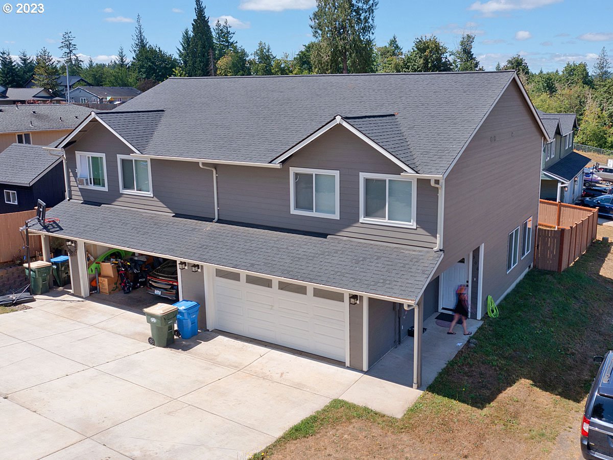 306 Oak Street Winlock, WA 98596 - Photo 4 of 35 a aerial view of a house next to a yard