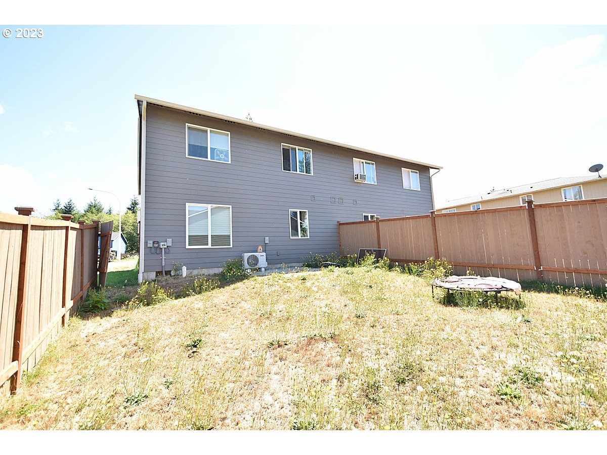 306 Oak Street Winlock, WA 98596 - Photo 8 of 35 a view of a backyard of the house