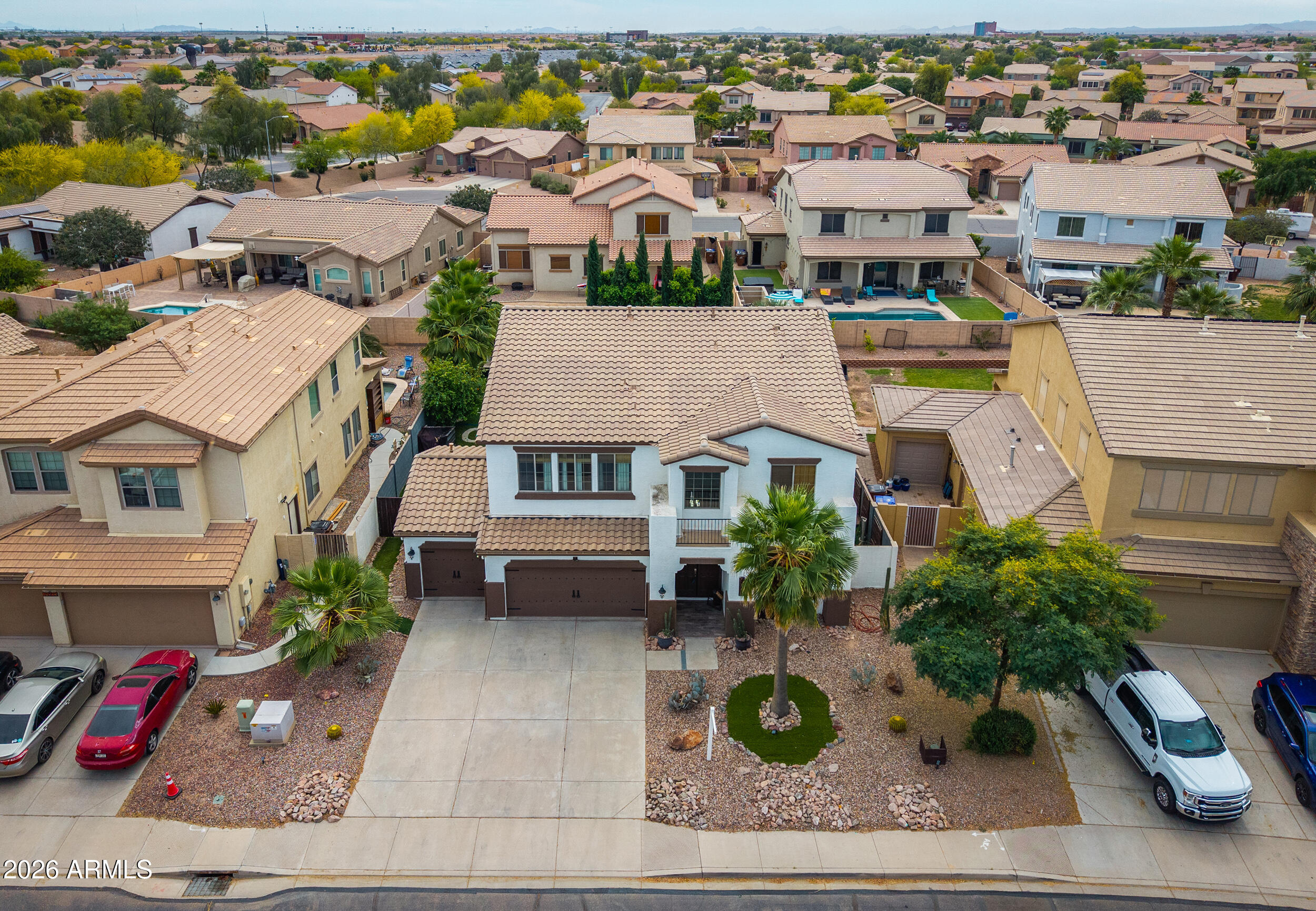 45247 West Jack Rabbit Trail Maricopa, AZ 85139 - Photo 75 of 75 an aerial view of multiple houses with a yard