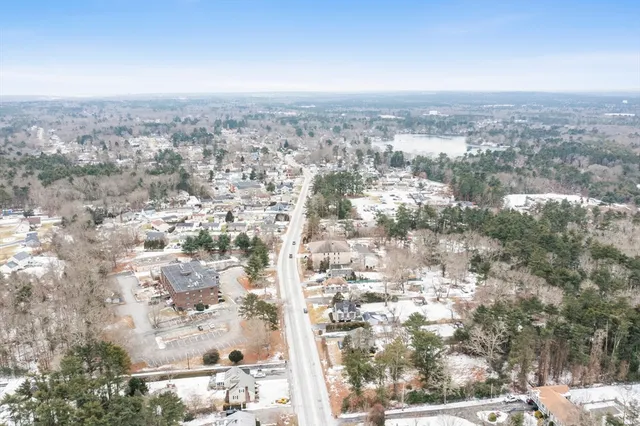 an aerial view of residential building with green space