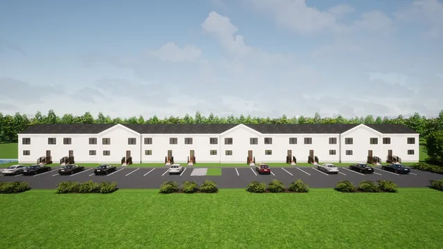 a view of an house with sitting area and garden