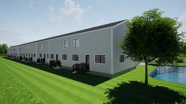 a backyard of a house with lots of green space and garden