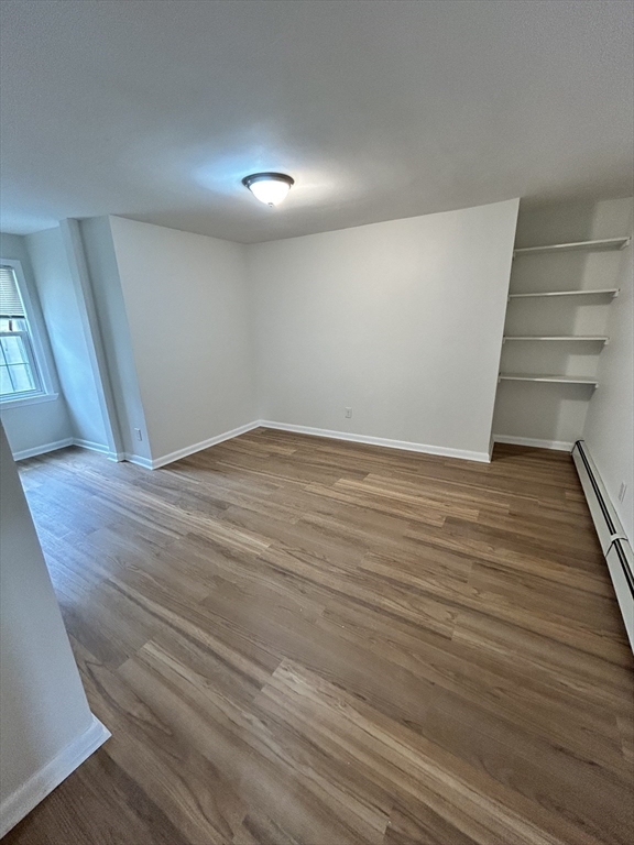 0 Main Street, Unit 1 Brockton, MA 02301 - Photo 9 of 9 a view of an empty room with wooden floor and stairs