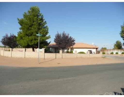 15160 Cheyenne Apple Valley, CA 92307 - Photo 1 of 1 a street view with couple of cars parked on road