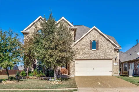 a view of a house with a street