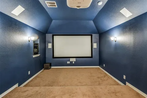 a view of a house with backyard and porch