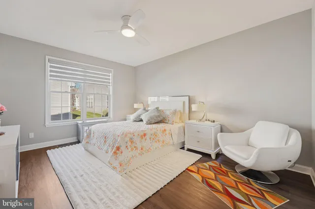 a bedroom with a bed and a lamp