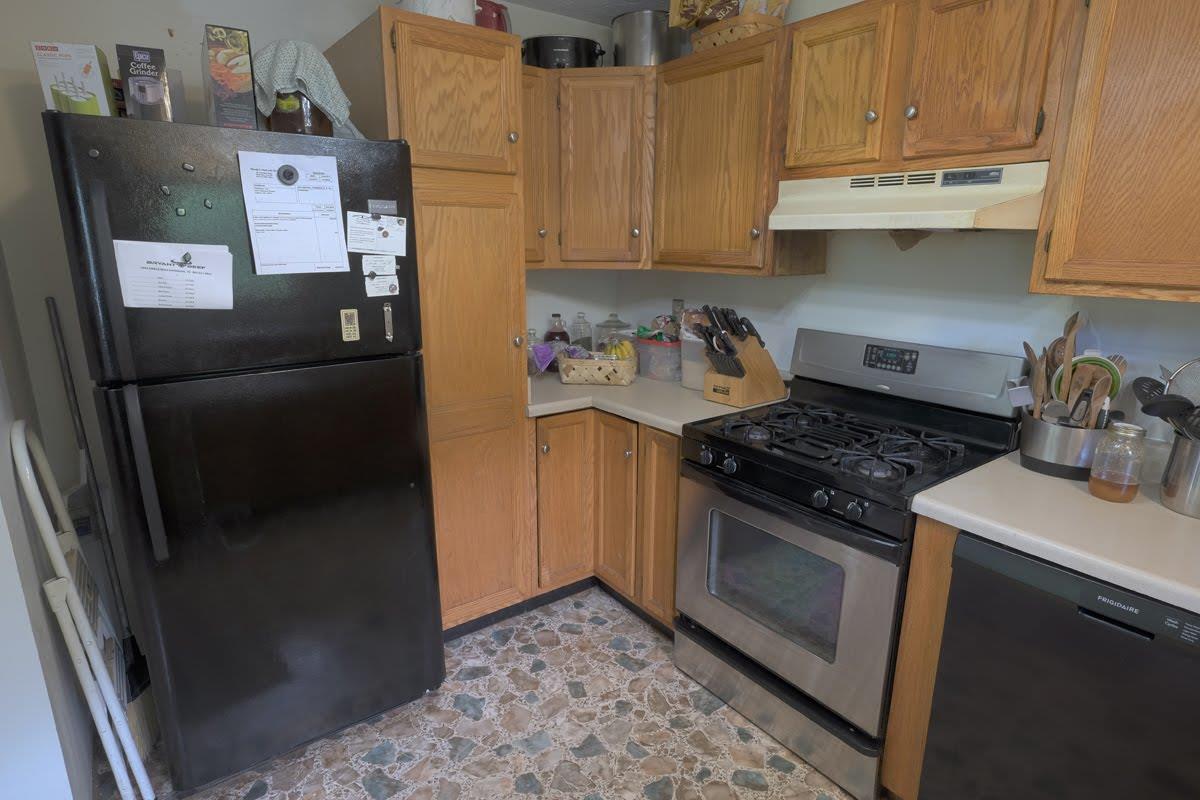 2341 Adamson Branch Road Liberty, TN 37095 - Photo 6 of 18 a kitchen with stainless steel appliances granite countertop a refrigerator and a stove