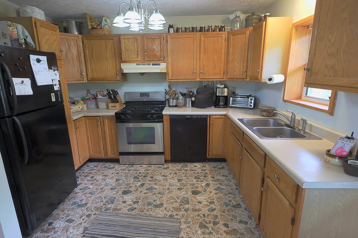 2341 Adamson Branch Road Liberty, TN 37095 - Photo 8 of 18 a kitchen with a sink stove and refrigerator