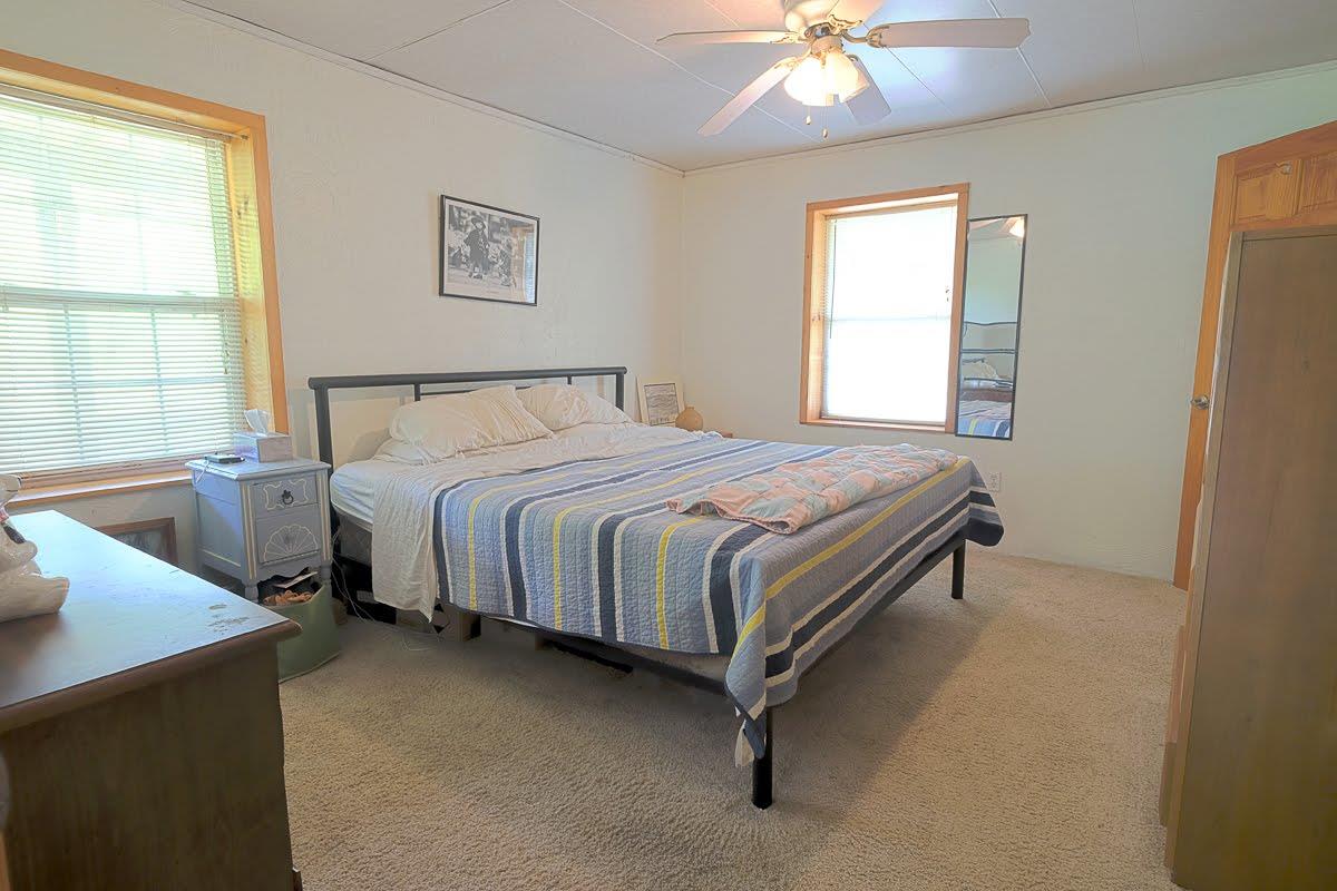 2341 Adamson Branch Road Liberty, TN 37095 - Photo 9 of 18 a bedroom with a bed and a chandelier
