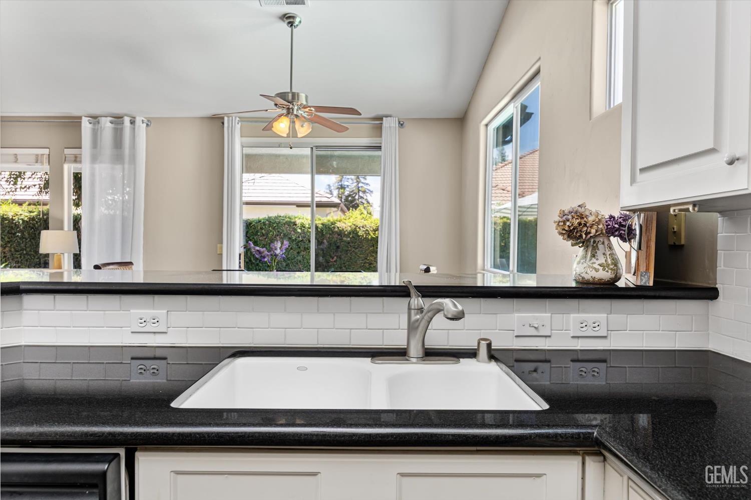Undisclosed Address Bakersfield, CA 93311 - Photo 23 of 39 a kitchen with a sink and a microwave