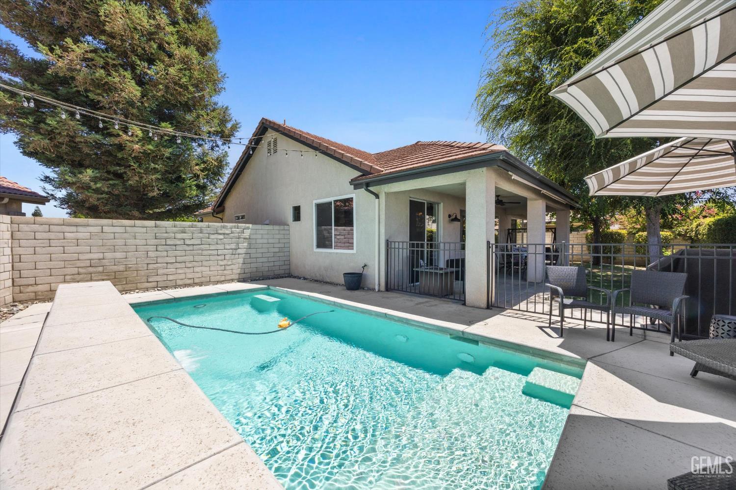 Undisclosed Address Bakersfield, CA 93311 - Photo 32 of 39 a view of outdoor space yard deck patio and swimming pool