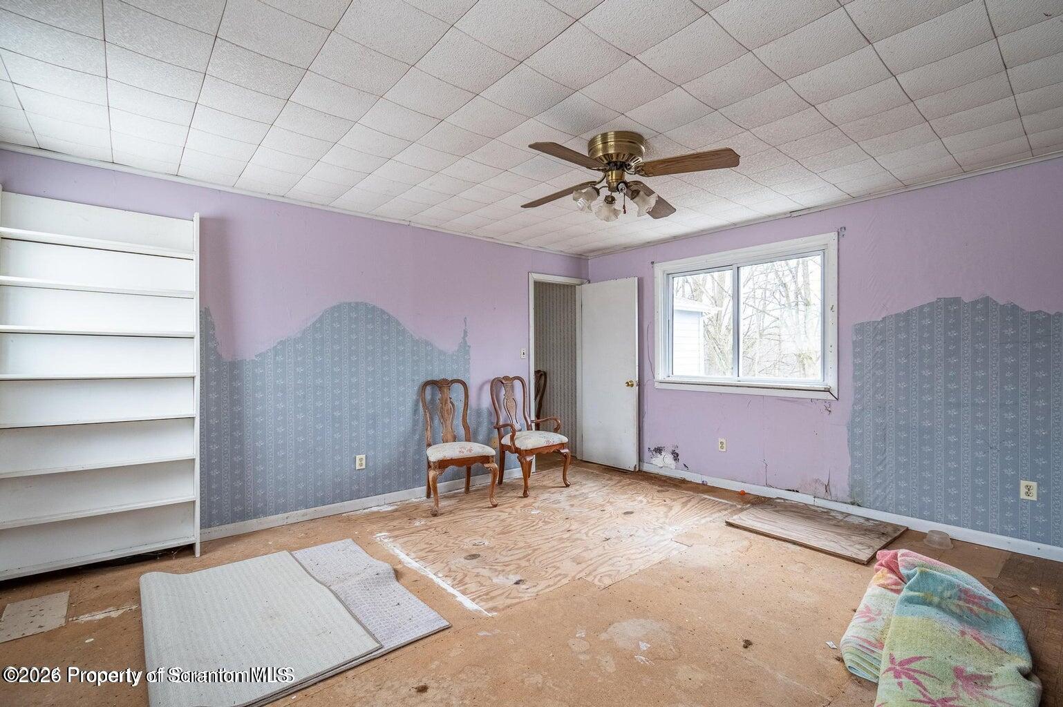 1777 Lamb Road Thompson, PA 18465 - Photo 17 of 31 a bedroom with furniture and a window