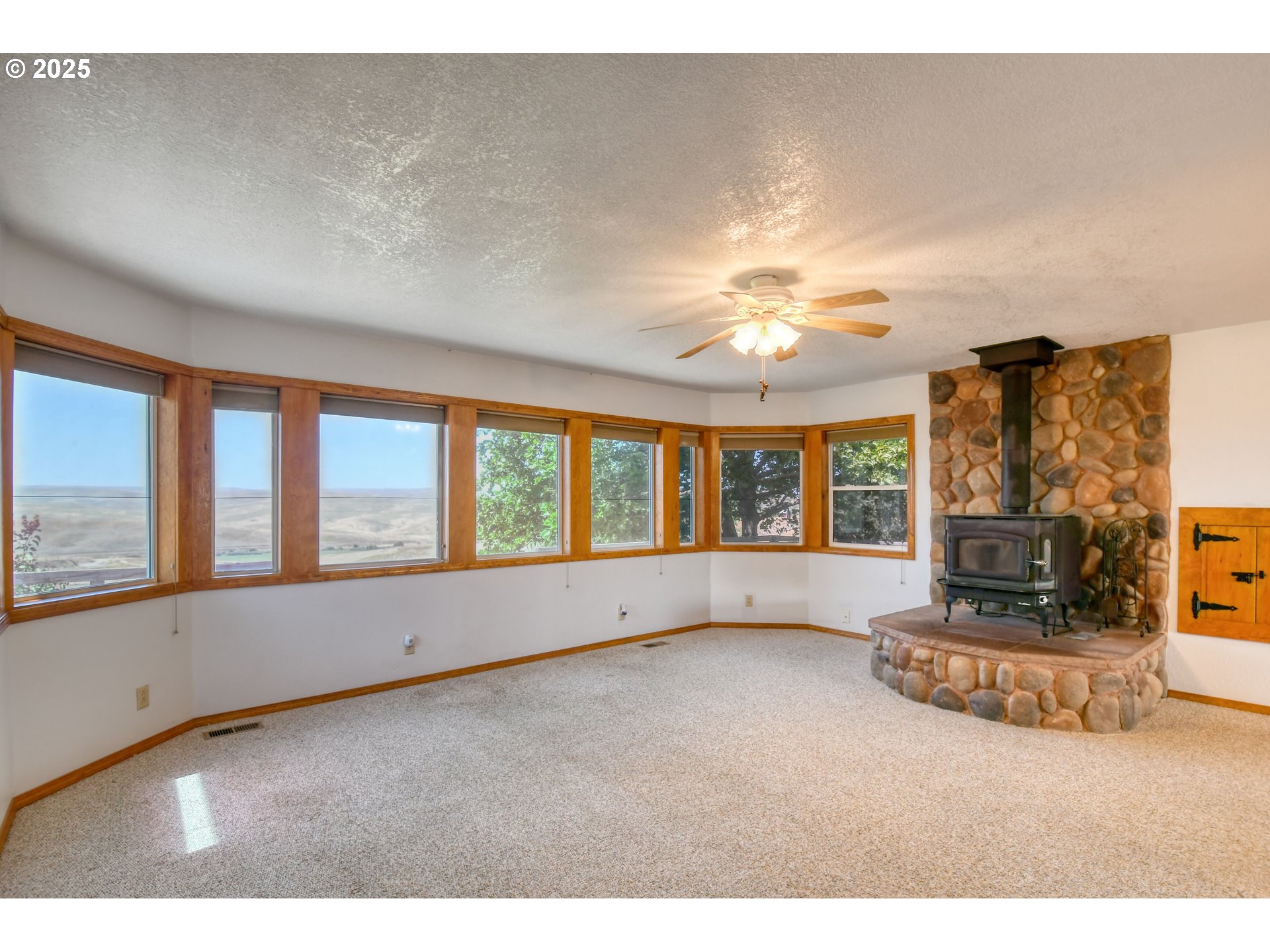72062 Westfield Boulevard Pendleton, OR 97801 - Photo 15 of 48 a living room with fireplace furniture and a large window