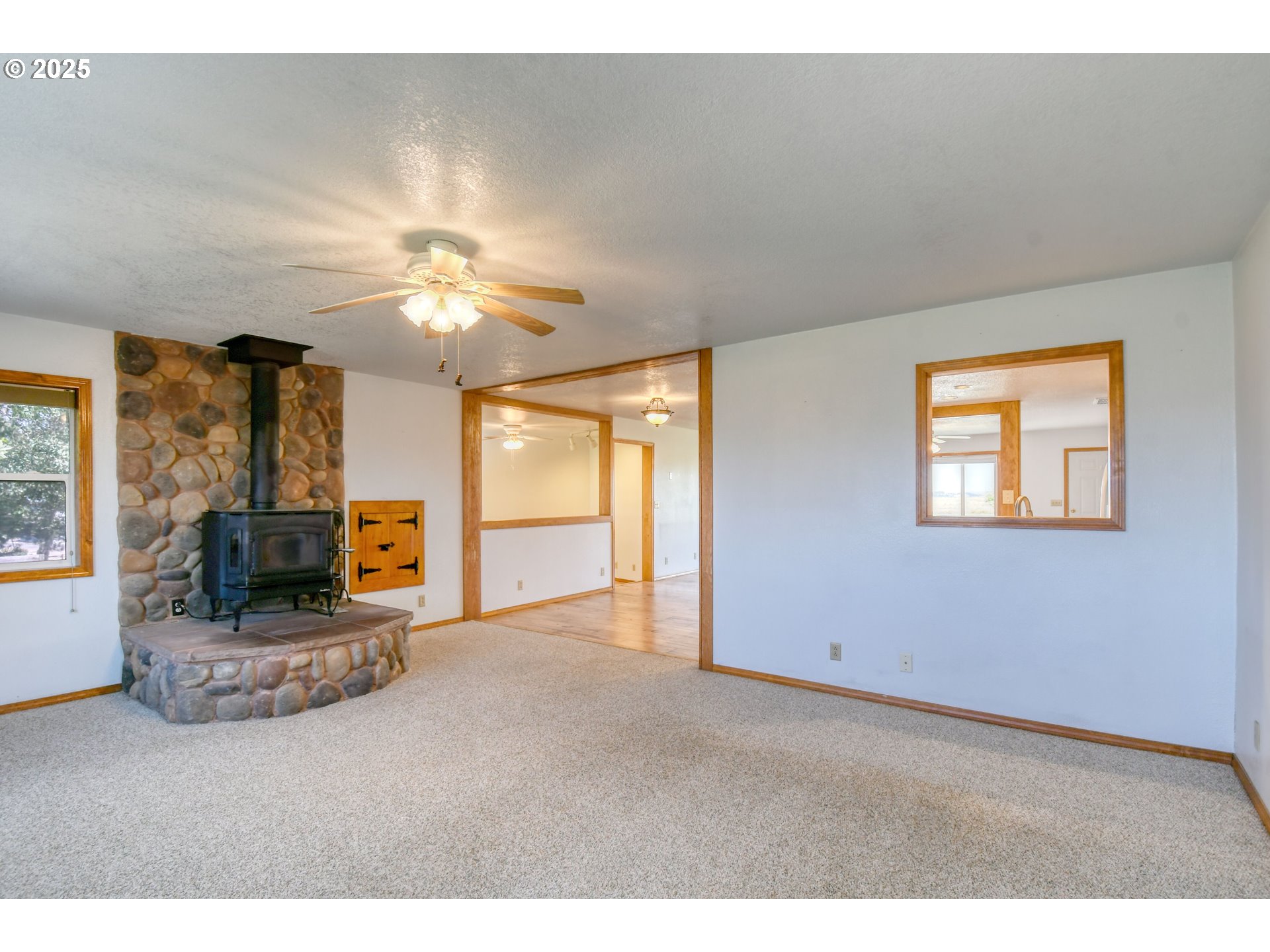 72062 Westfield Boulevard Pendleton, OR 97801 - Photo 16 of 48 a living room with fireplace furniture and a flat screen tv