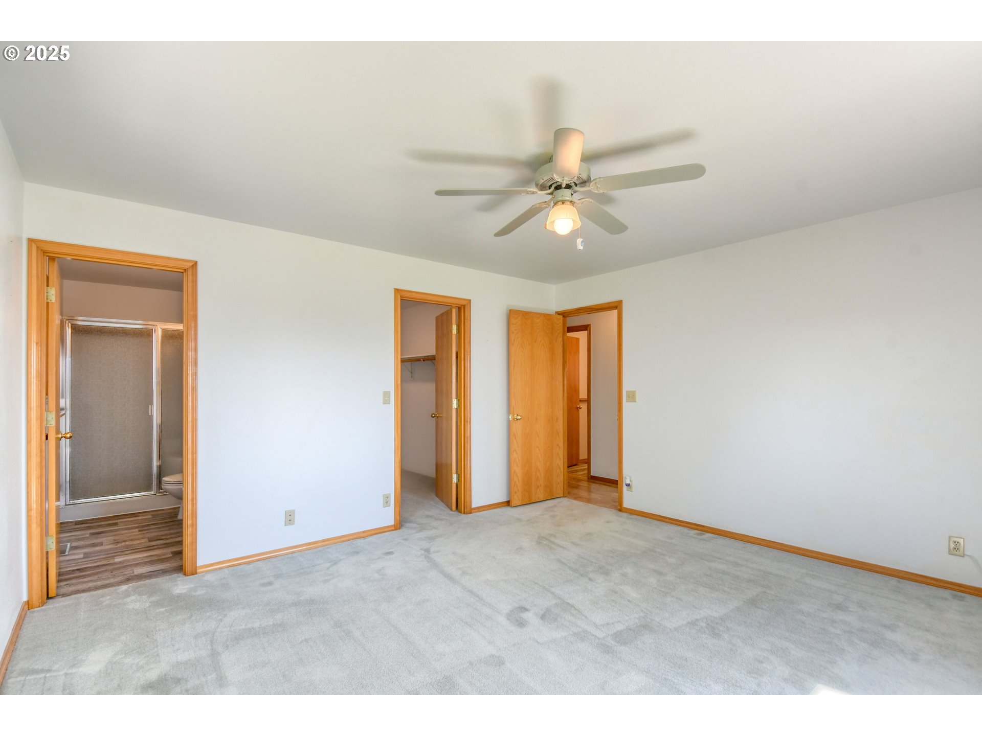 72062 Westfield Boulevard Pendleton, OR 97801 - Photo 20 of 48 a view of an empty room with closet and a ceiling fan