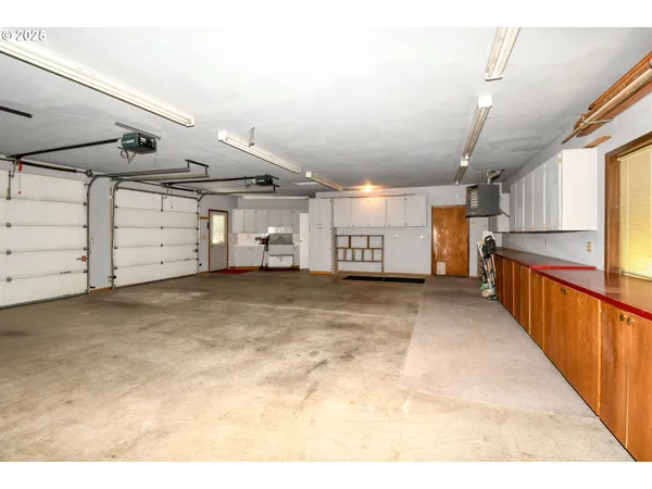 a kitchen with a refrigerator and a sink