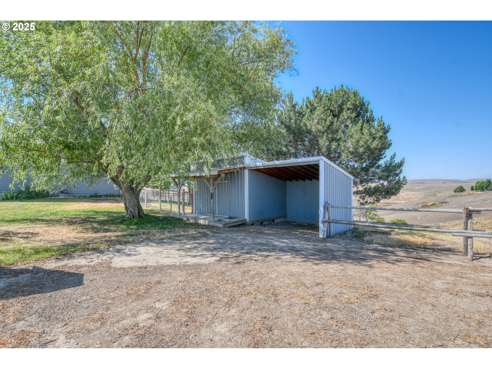 72062 Westfield Boulevard Pendleton, OR 97801 - Photo 43 of 48 a view of a yard with a tree