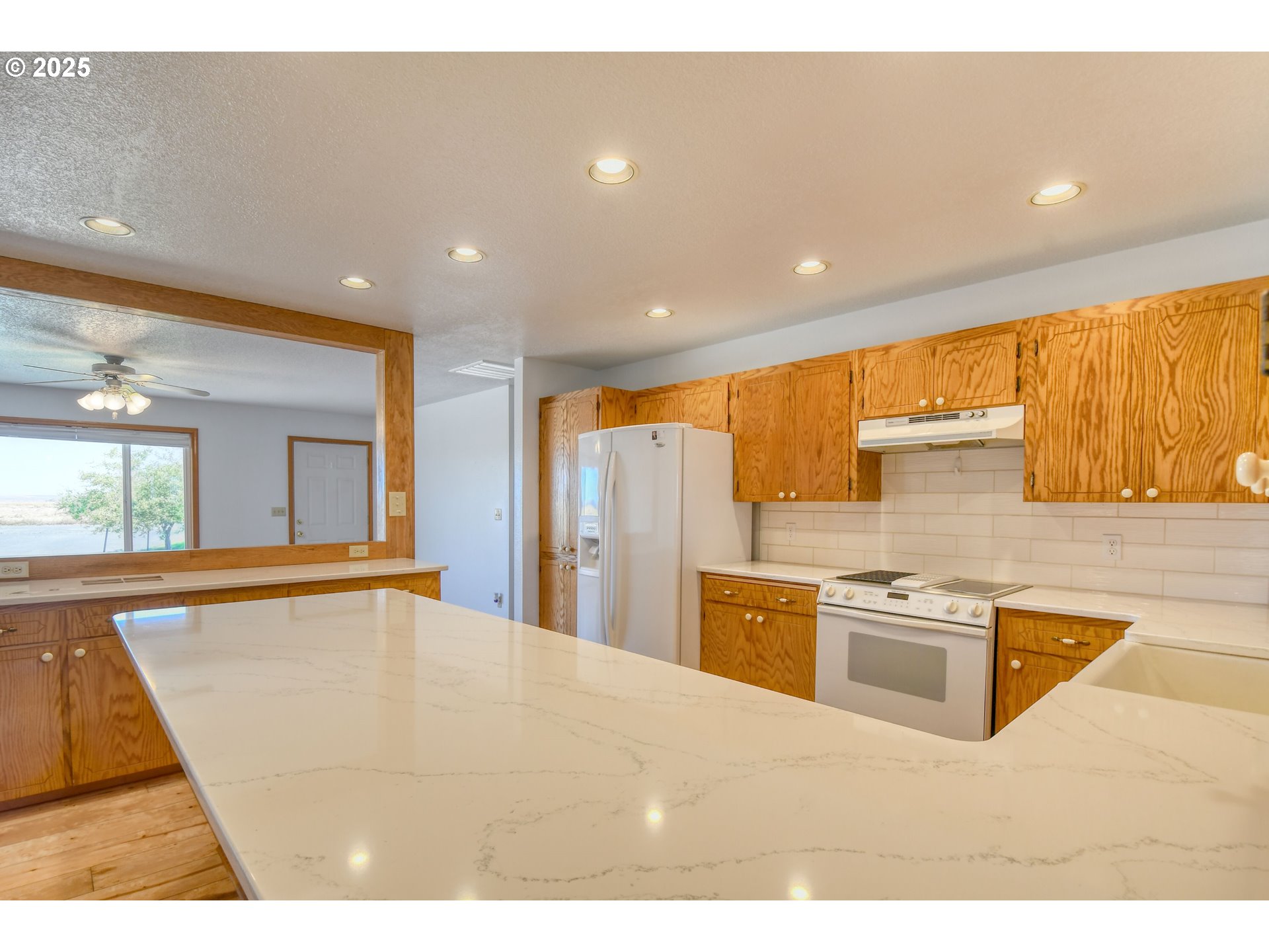 72062 Westfield Boulevard Pendleton, OR 97801 - Photo 8 of 48 a kitchen with stainless steel appliances granite countertop a sink and a refrigerator