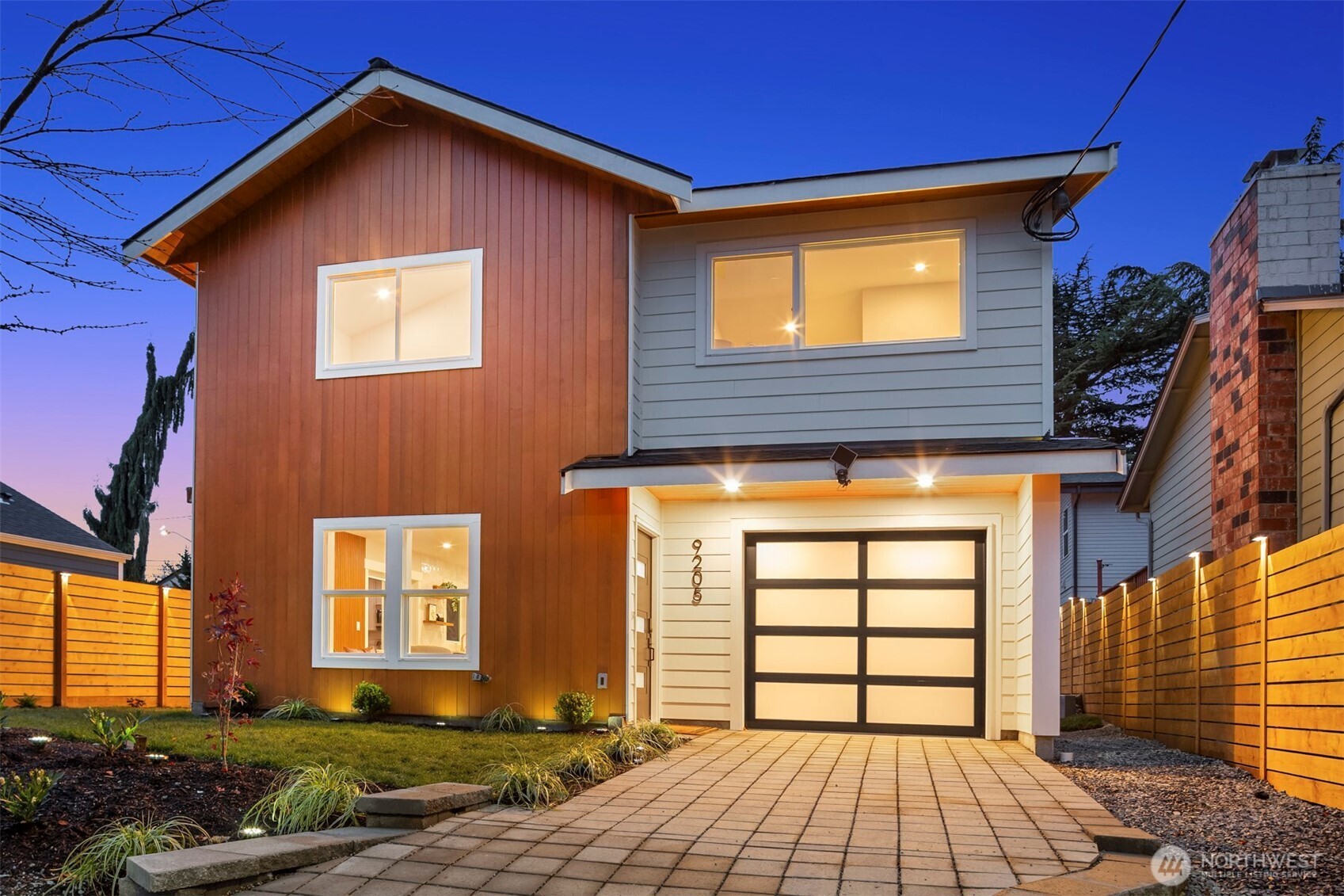9205 Evanston Avenue North Seattle, WA 98103 - Photo 1 of 21 a front view of a house with a yard