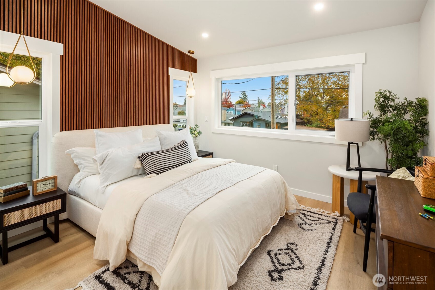 9205 Evanston Avenue North Seattle, WA 98103 - Photo 12 of 21 a bedroom with a large bed and a window