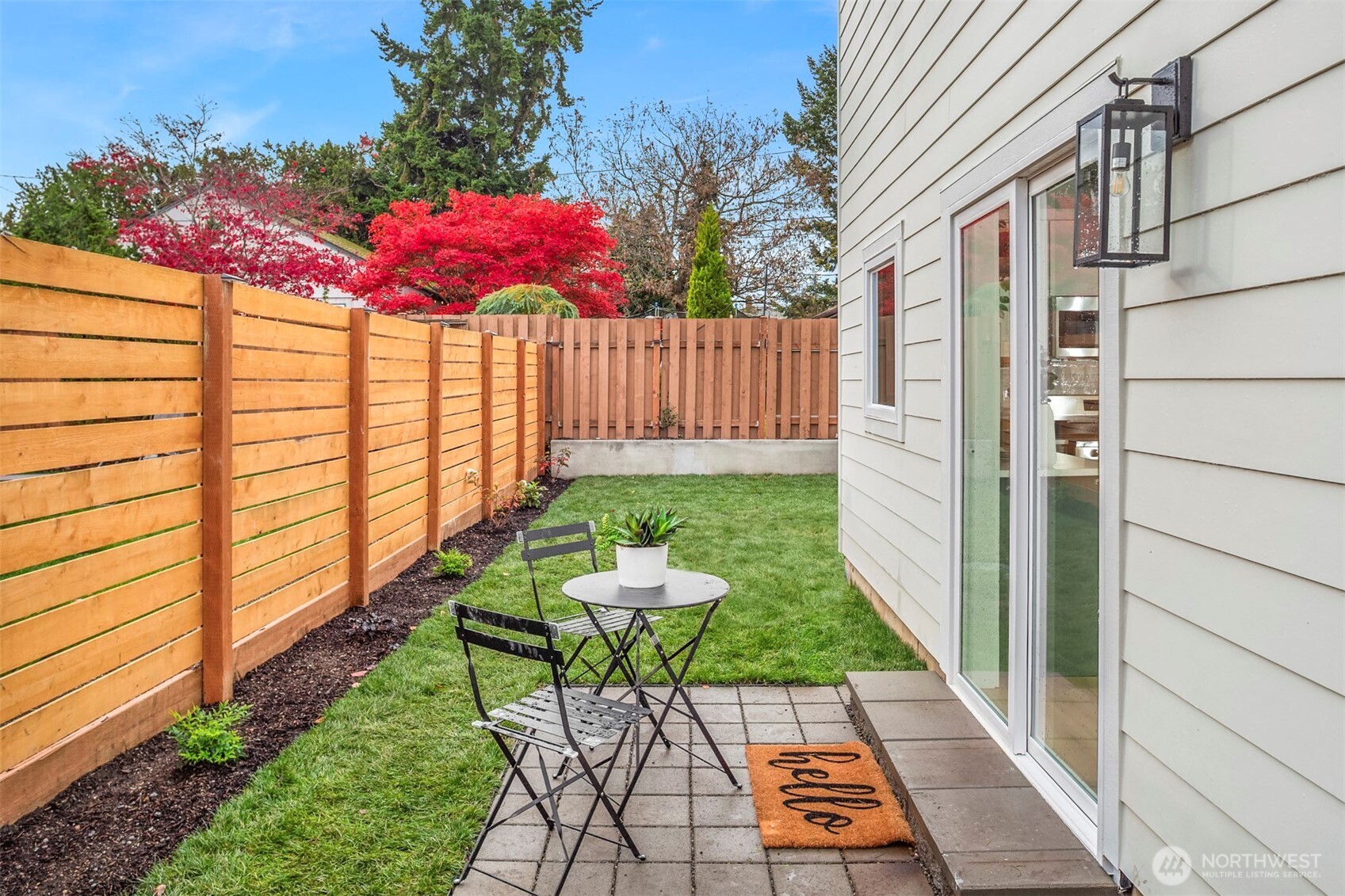 9205 Evanston Avenue North Seattle, WA 98103 - Photo 17 of 21 a view of a backyard with sitting area