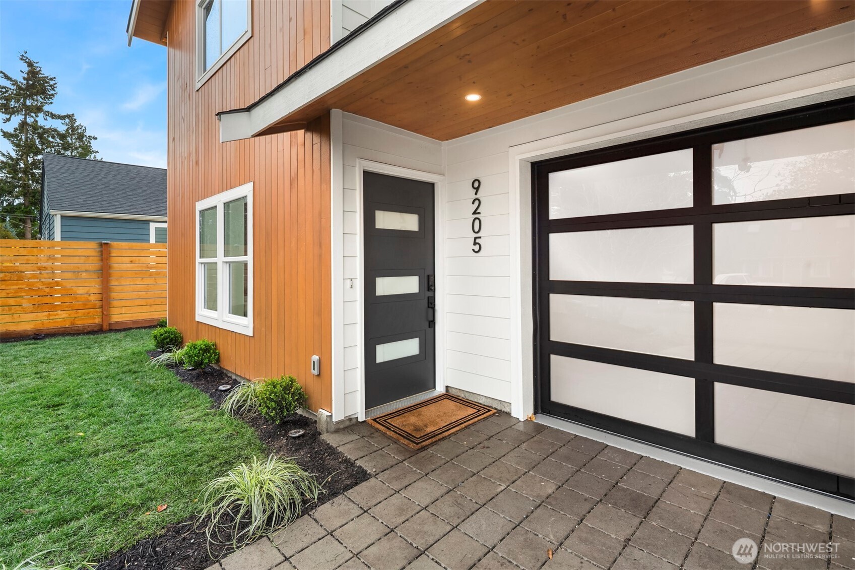 9205 Evanston Avenue North Seattle, WA 98103 - Photo 2 of 21 a front view of a house with a yard