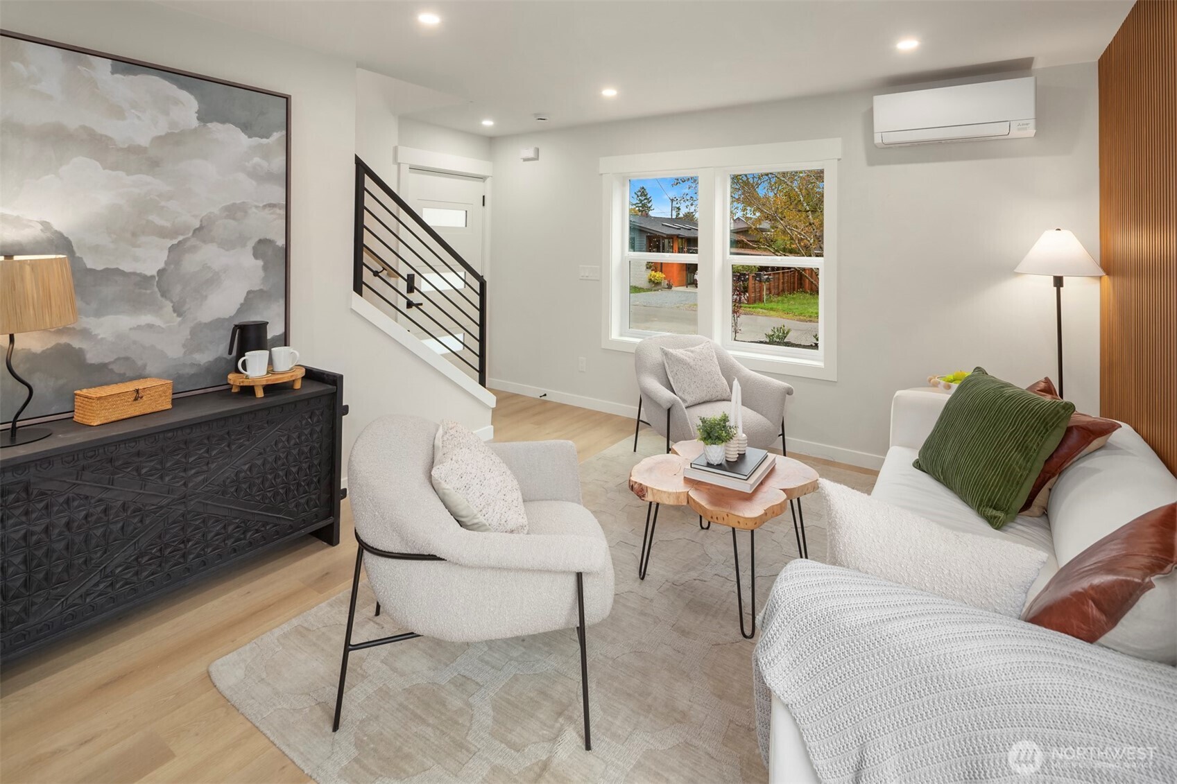 9205 Evanston Avenue North Seattle, WA 98103 - Photo 4 of 21 a living room with furniture and a painting on the wall
