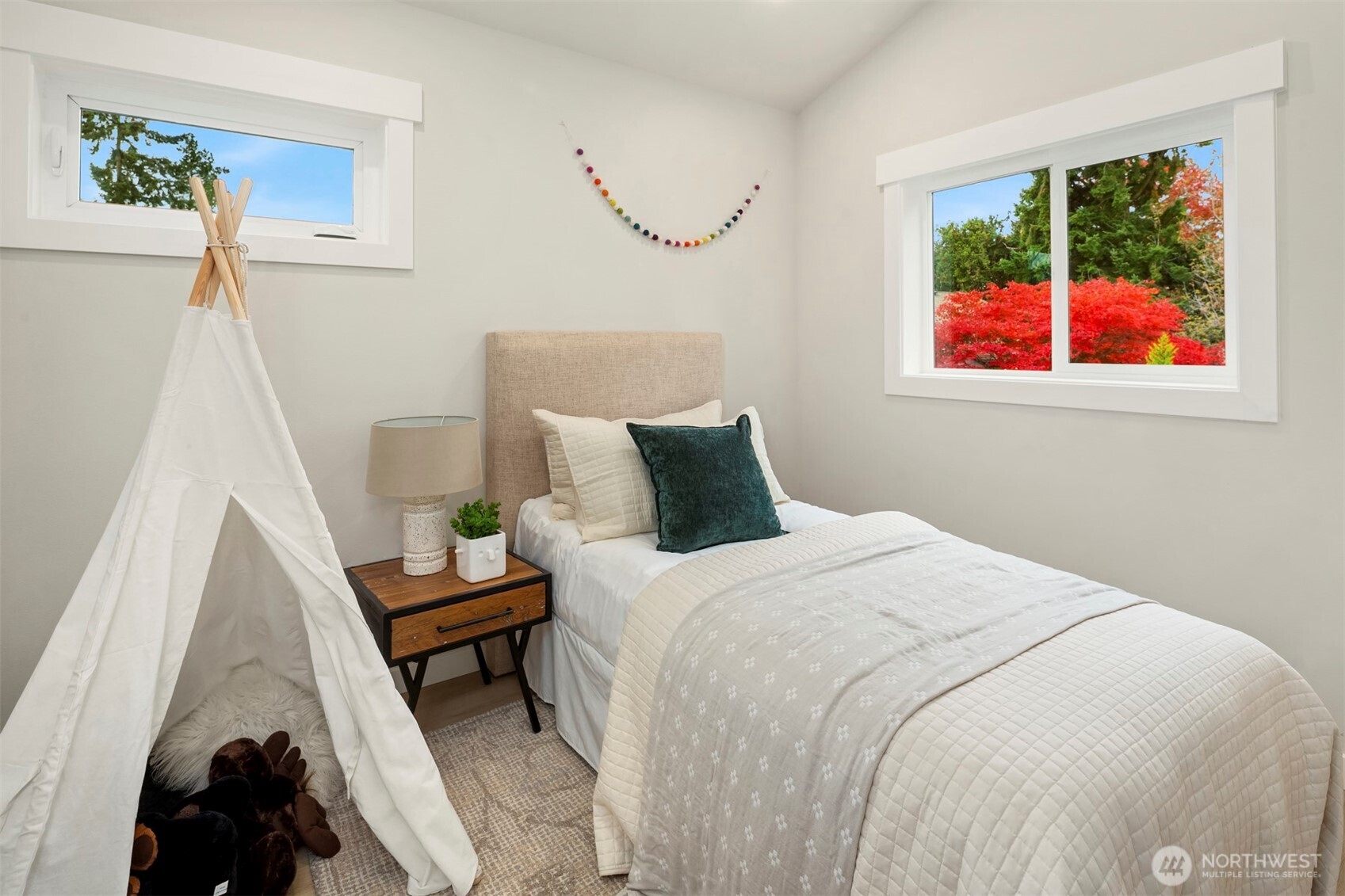 9205 Evanston Avenue North Seattle, WA 98103 - Photo 8 of 21 a bedroom with a bed and a window