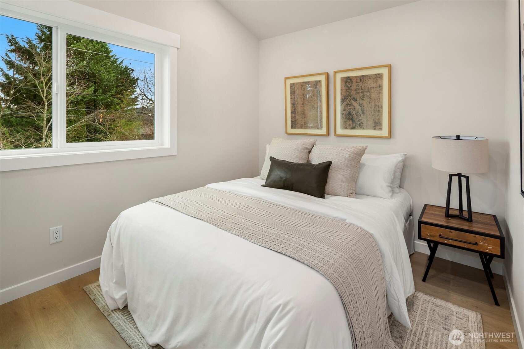 9205 Evanston Avenue North Seattle, WA 98103 - Photo 9 of 21 a bedroom with a bed and a window