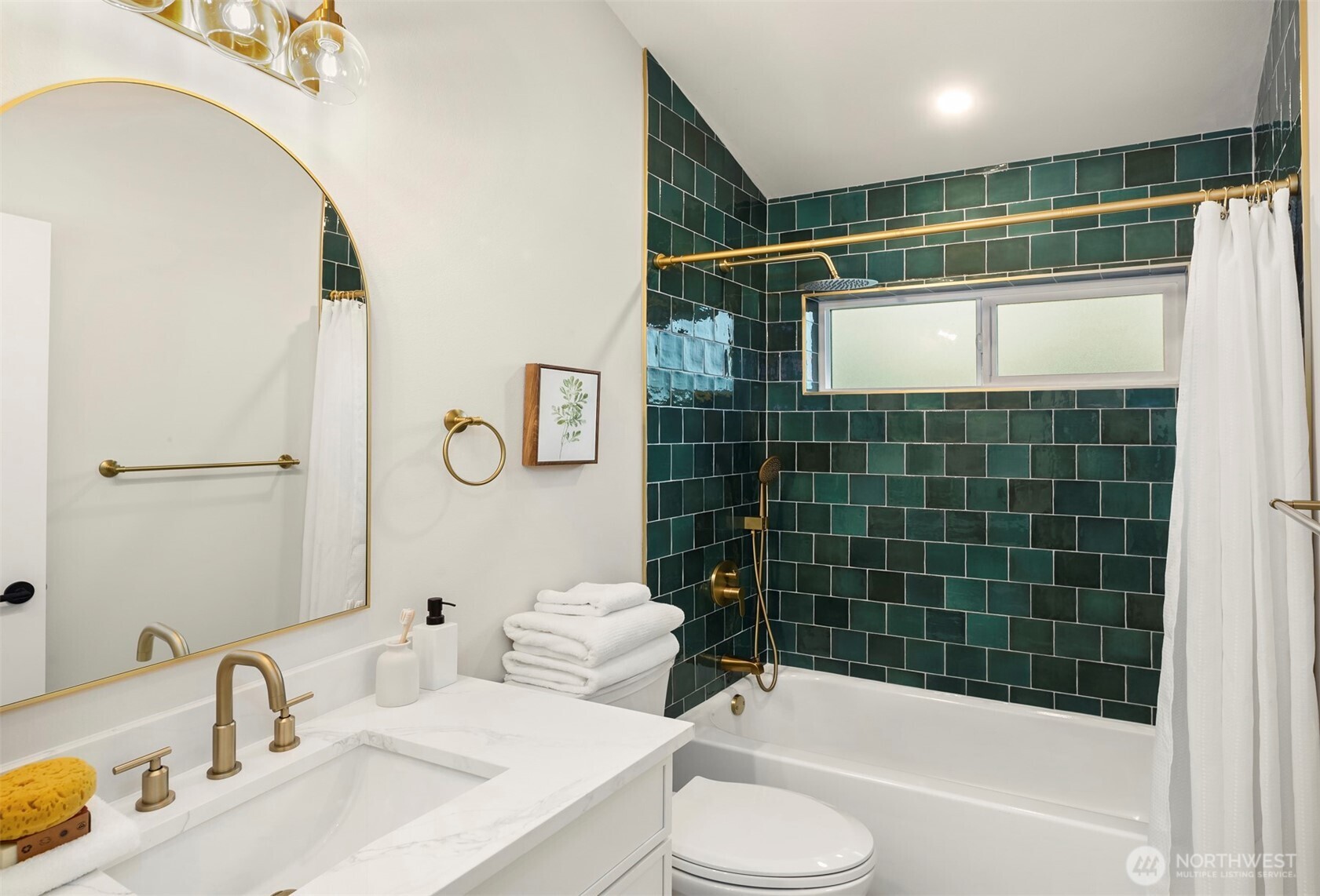 9205 Evanston Avenue North Seattle, WA 98103 - Photo 10 of 21 a bathroom with a sink toilet and shower