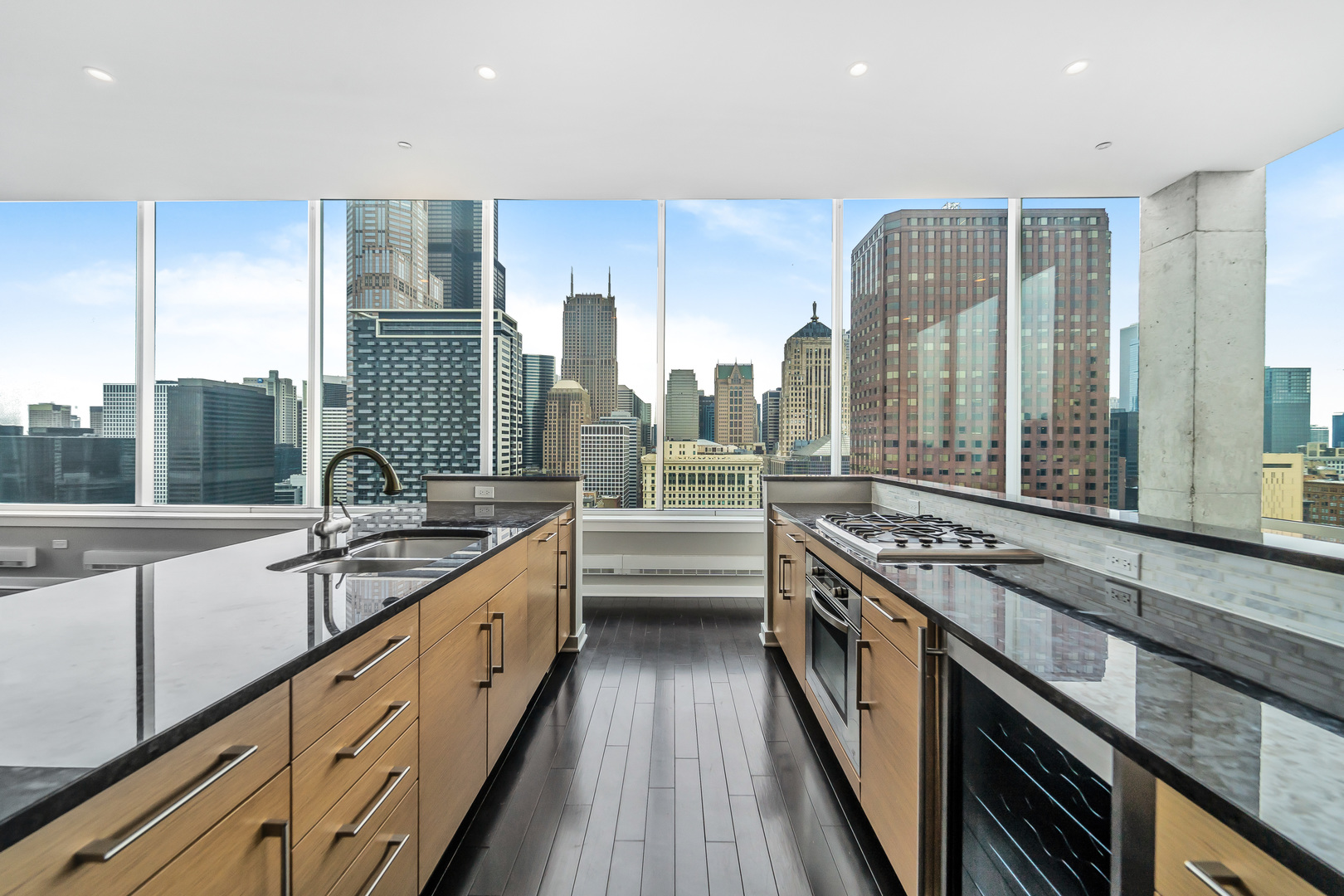 611 South Wells Street, Unit 3102 Chicago, IL 60607 - Photo 12 of 33 a kitchen with stainless steel appliances a sink stove and cabinets
